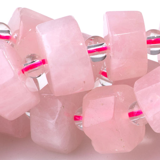 This is a Dakota Stones 6x10-13mm Rose Quartz Wheel Gemstone strand with faceted beads in 15-16 inch strand.