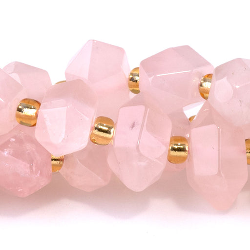 This is a Dakota Stones 6x11mm Rose Quartz Points Gemstone strand of round beads in 15-16 inch strand.