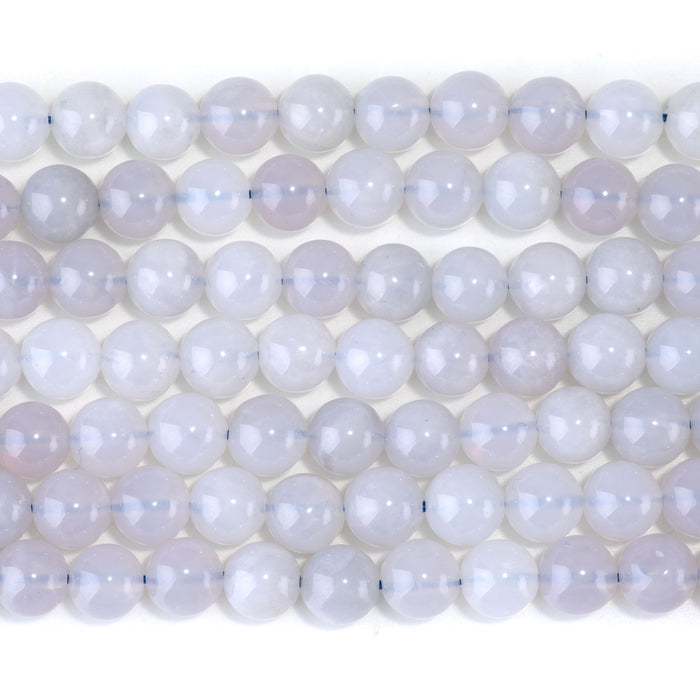This is a Dakota Stones 8mm Blue Rose Quartz Gemstone strand with round beads in 15-16 inch strand.