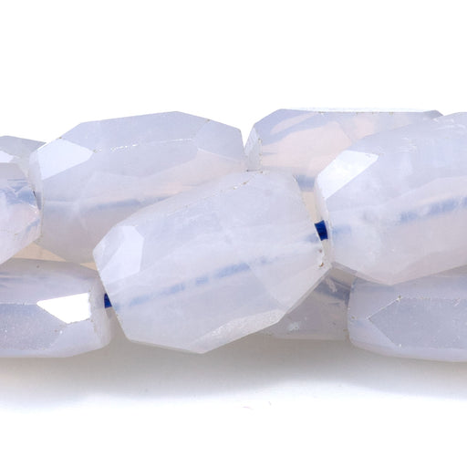 This is a Dakota Stones 9x13mm Blue Rose Quartz Rectangle Gemstone strand with faceted free-form beads in 15-16 inch strand.