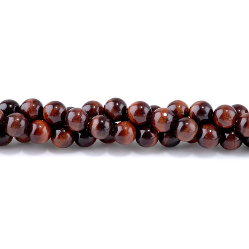 This is a Dakota Stones 10mm Red Tiger Eye Gemstone strand with round beads in 15-16 inch strand.