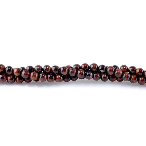 This is a Dakota Stones 6mm Red Tiger Eye Gemstone strand with round beads in 15-16 inch strand.