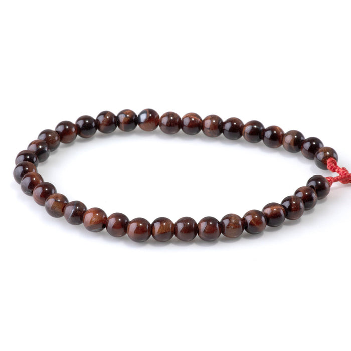 This is a Dakota Stones 6mm Red Tiger Eye Large Hole Gemstone strand with round beads in 8 inch strand.