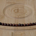 This is a Dakota Stones 6mm Red Tiger Eye Large Hole Gemstone strand with round beads in 8 inch strand.