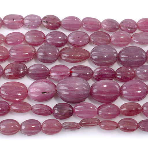 This is a Dakota Stones 6-16mm Ruby Carved Gemstone strand with oval beads in 15-16 inch strand.