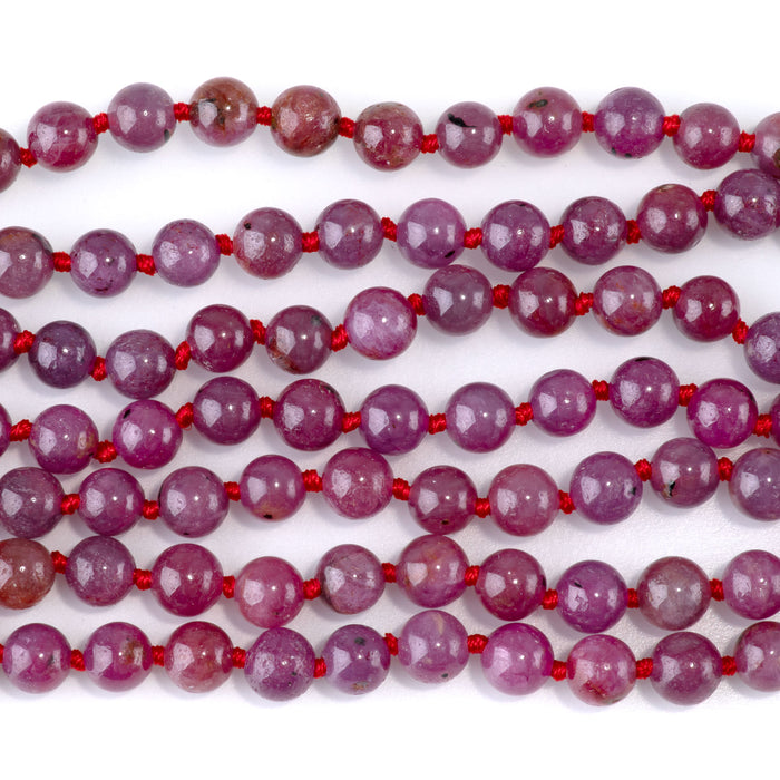 This is a Dakota Stones 6mm Ruby Gemstone strand with AAA grade round beads in 15-16 inch strand.