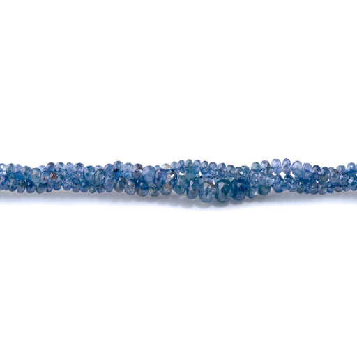 This is a Dakota Stones 3-6mm Blue Sapphire Gemstone strand with natural faceted rondelle beads in 15-16 inch strand.