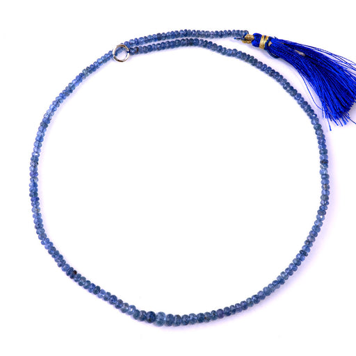 This is a Dakota Stones 3-6mm Blue Sapphire Gemstone strand with natural faceted rondelle beads in 15-16 inch strand.