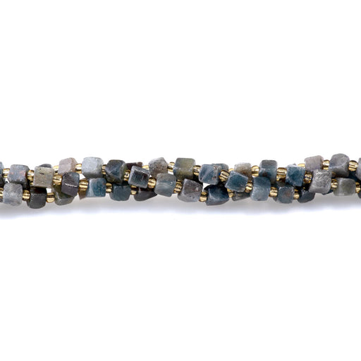 This is a Dakota Stones 5-6mm Sapphire Gemstone strand with irregular cube beads in 15-16 inch strand.