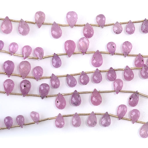 This is a Dakota Stones 6x10mm Pink Sapphire Drops Gemstone strand of round beads in 8 inch strand.