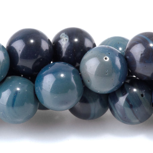 This is a Dakota Stones 8mm Sieber Agate Gemstone strand with AA grade round beads in 15-16 inch strand.