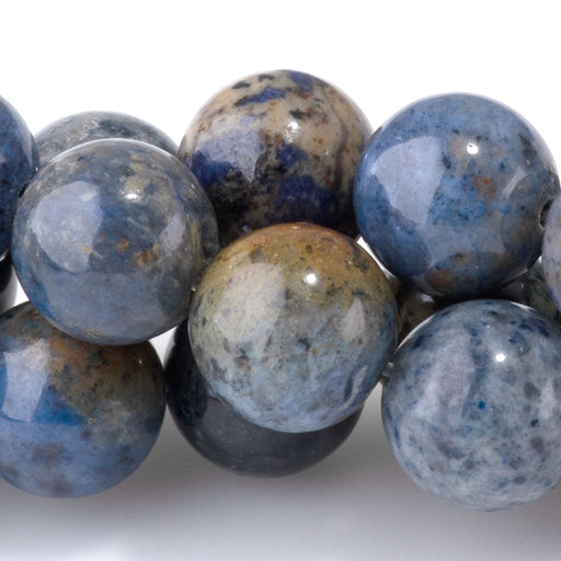 This is a Dakota Stones 10mm Sunset Dumortierite Gemstone strand with round beads in 15-16 inch strand.