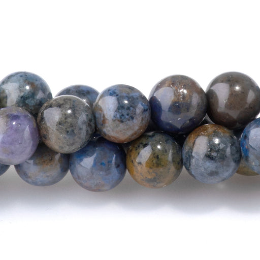 This is a Dakota Stones 6mm Sunset Dumortierite Gemstone strand with round beads in 15-16 inch strand.