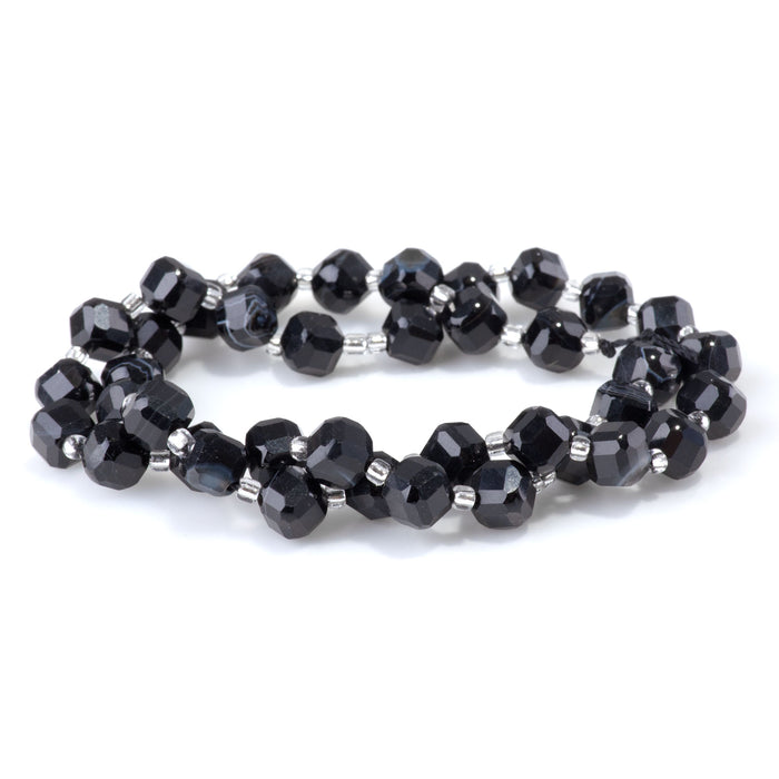 This is a Dakota Stones 6x8mm Black Sardonyx Corner Gemstone strand with table-cut cube beads in 15-16 inch strand.