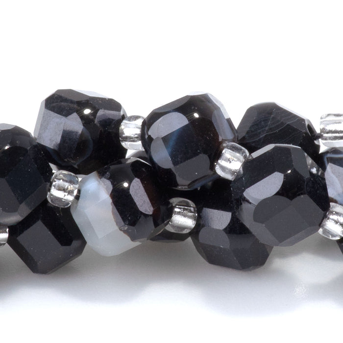 This is a Dakota Stones 6x8mm Black Sardonyx Corner Gemstone strand with table-cut cube beads in 15-16 inch strand.