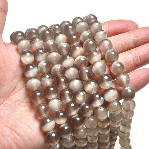 This is a Dakota Stones Chocolate Selenite Gemstone strand with round beads in 15-16 inch strand.