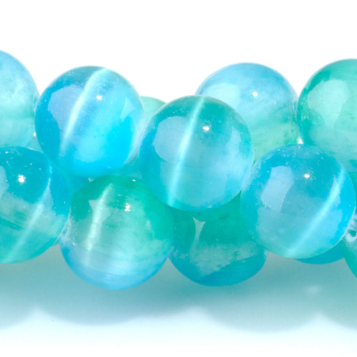 This is a Dakota Stones 10mm Selenite Green Blue Gemstone strand with dyed round beads in 15-16 inch strand.