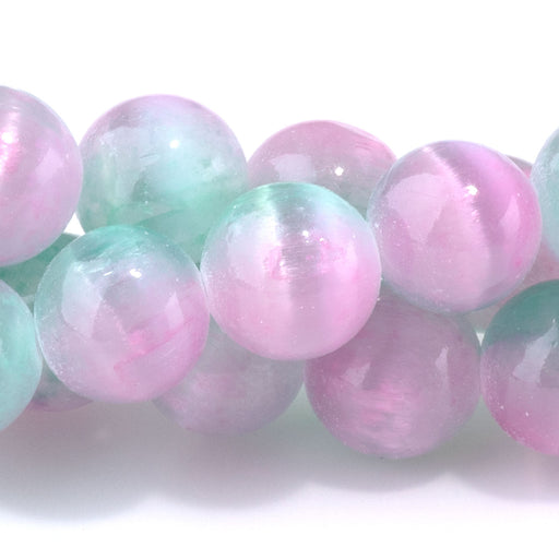 This is a Dakota Stones 10mm Selenite Green Pink Gemstone strand with dyed round beads in 15-16 inch strand.