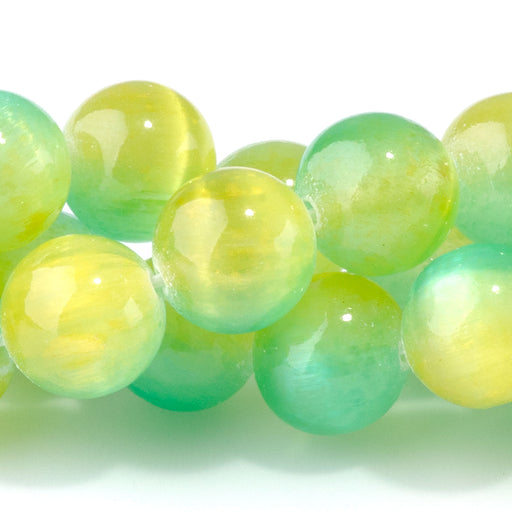 This is a Dakota Stones 10mm Selenite Green Yellow Gemstone strand with dyed round beads in 15-16 inch strand.