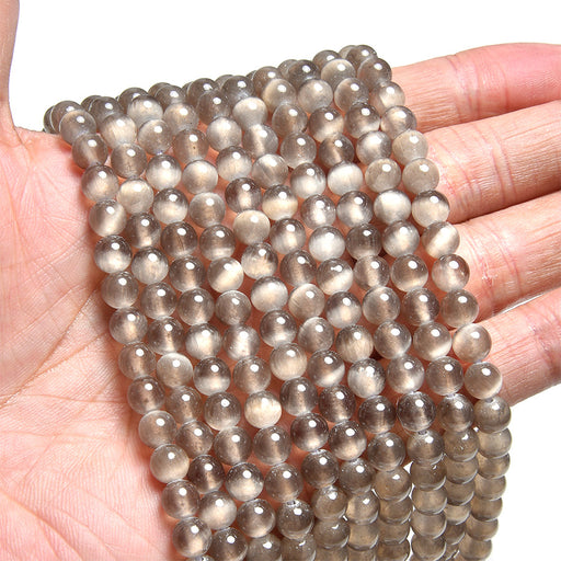 This is a Dakota Stones 6mm Chocolate Selenite Gemstone strand with round beads in 15-16 inch strand.