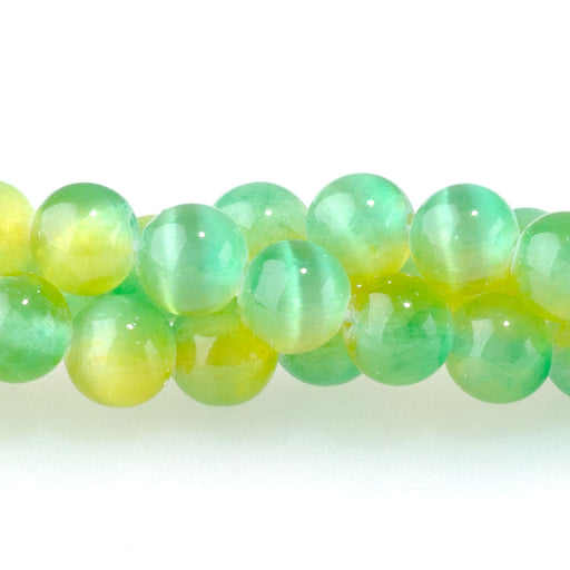 This is a Dakota Stones 6mm Selenite Green Yellow Gemstone strand with dyed round beads in 15-16 inch strand.
