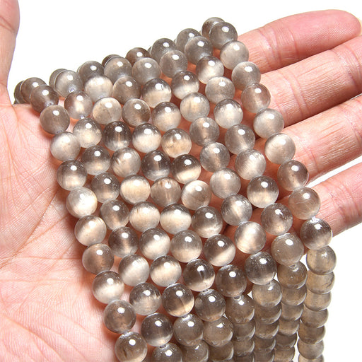 This is a Dakota Stones 8mm Chocolate Selenite Gemstone strand with round beads in 15-16 inch strand.