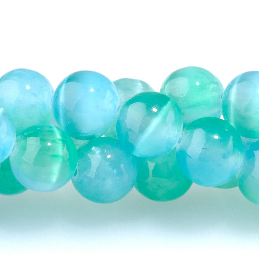 This is a Dakota Stones 8mm Selenite Green Blue Gemstone strand with dyed round beads in 15-16 inch strand.