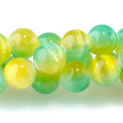 This is a Dakota Stones 8mm Selenite Green Yellow Gemstone strand with dyed round beads in 15-16 inch strand.