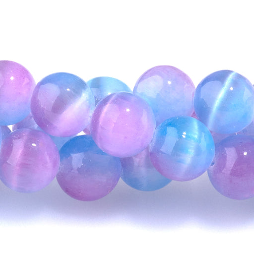 This is a Dakota Stones 8mm Selenite Purple Pink Gemstone strand with dyed round beads in 15-16 inch strand.