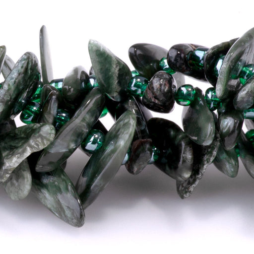 This is a Dakota Stones 5x10-20mm Seraphinite Top Drill Teeth Gemstone strand of round beads in 15-16 inch strand.