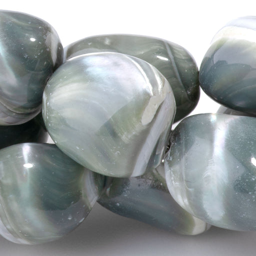 This is a Dakota Stones 12-14mm Troca Shell Green Gemstone strand with dyed free-form beads in 15-16 inch strand.