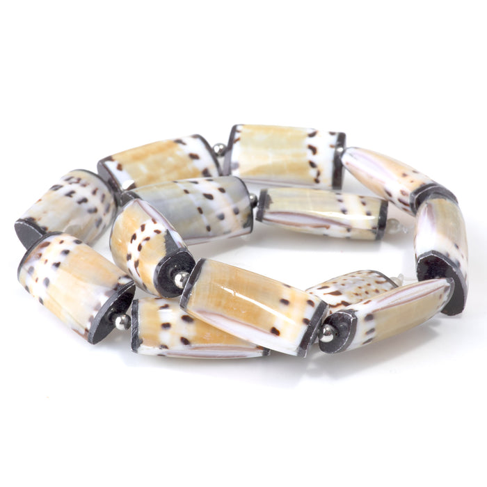This is a Dakota Stones 15x28mm Conus Capitaneus Shell Puff Rectangle Gemstone strand of round beads in 15-16 inch strand.