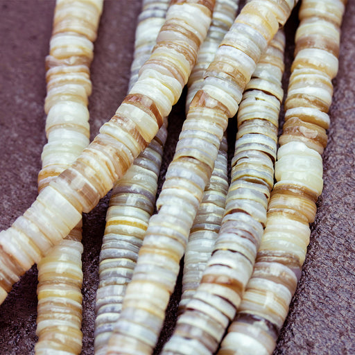 This is a Dakota Stones 5mm Hammer Shell Gemstone strand with heishi beads in 15-16 inch strand.