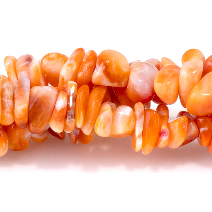 This is a Dakota Stones 5-8mm Spiny Oyster Chips Orange Gemstone strand with free-form beads in 15-16 inch strand.