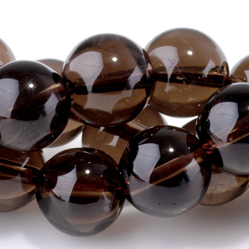 This is a Dakota Stones 10mm Smoky Quartz Gemstone strand with round beads in 15-16 inch strand.