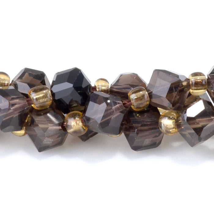 This is a Dakota Stones 4x6mm Smoky Quartz Corner Gemstone strand with table-cut cube beads in 15-16 inch strand.