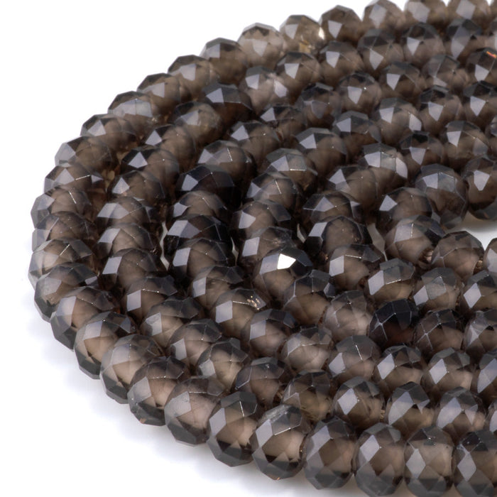 This is a Dakota Stones 8mm Smoky Quartz Large Hole Gemstone strand with faceted rondelle beads in 8 inch strand.
