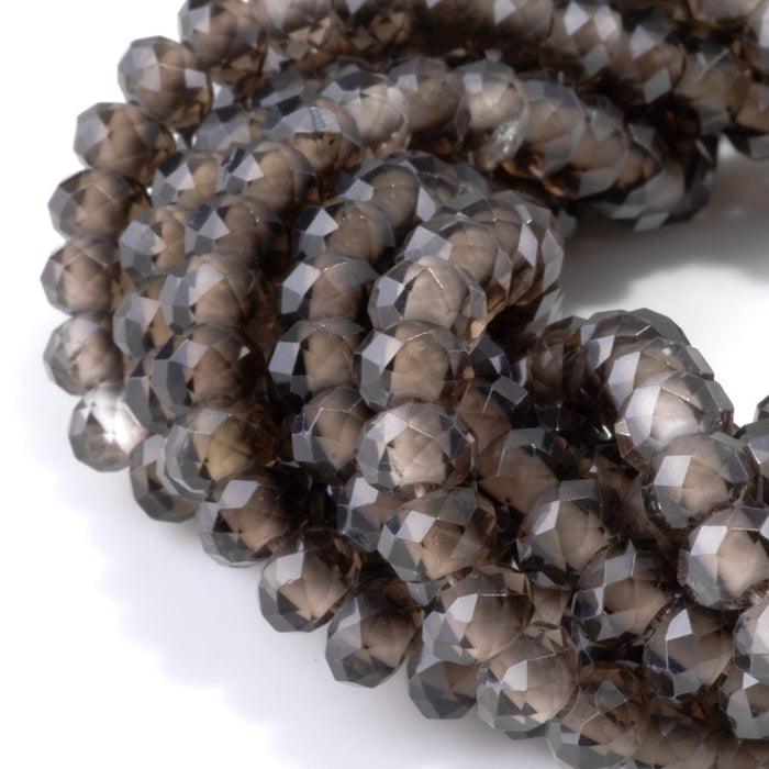 This is a Dakota Stones 8mm Smoky Quartz Large Hole Gemstone strand with faceted rondelle beads in 8 inch strand.