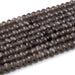 This is a Dakota Stones 8mm Smoky Quartz Large Hole Gemstone strand with faceted rondelle beads in 8 inch strand.