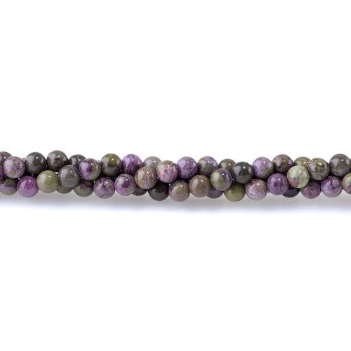 This is a Dakota Stones 6mm Atlantisite Stichtite Gemstone strand with round beads in 15-16 inch strand.