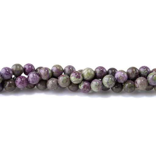 This is a Dakota Stones 8mm Atlantisite Stichtite Gemstone strand with round beads in 15-16 inch strand.