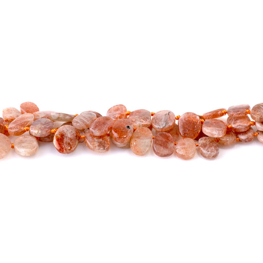 This is a Dakota Stones 6x9-9x14mm Golden Sunstone Top Drill Gemstone strand with oval beads in 15-16 inch strand.