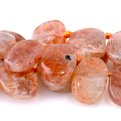 This is a Dakota Stones 6x9-9x14mm Golden Sunstone Top Drill Gemstone strand with oval beads in 15-16 inch strand.