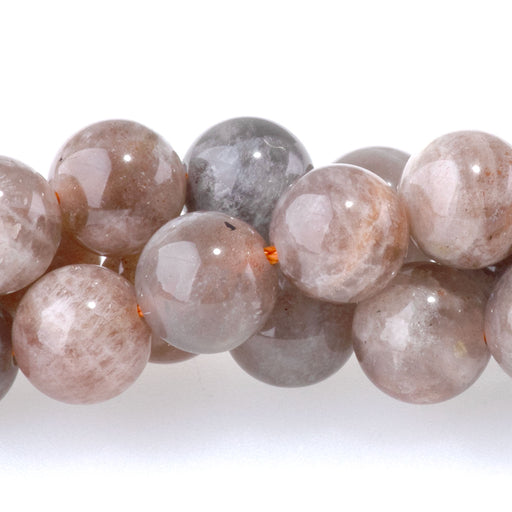 This is a Dakota Stones 8mm Copper Sunstone Gemstone strand with round beads in 15-16 inch strand.