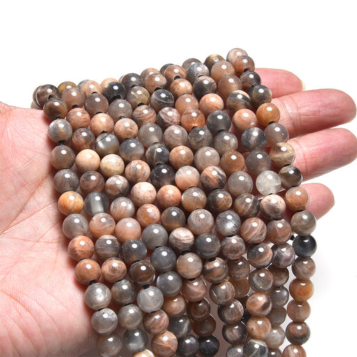 This is a Dakota Stones 8mm Black Sunstone Large Hole Gemstone strand with round beads in 8 inch strand.