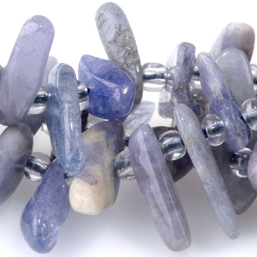 This is a Dakota Stones 5x10-20mm Tanzanite Top Drill Teeth Gemstone strand of round beads in 15-16 inch strand.