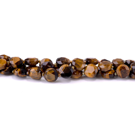 This is a Dakota Stones 12mm Tiger Eye Cut Gemstone strand with coin star beads in 15-16 inch strand.