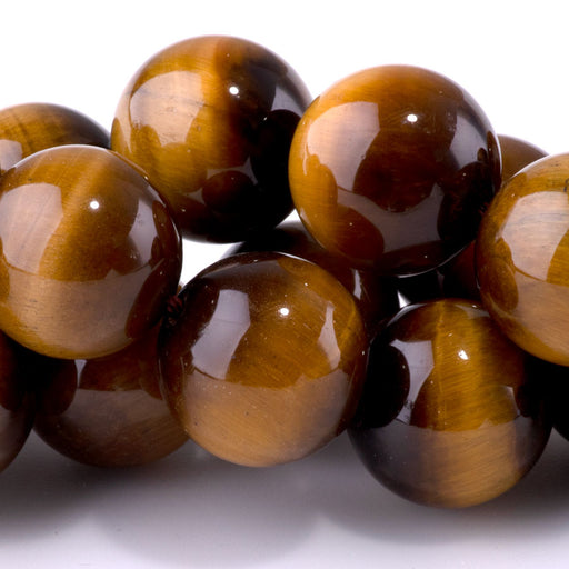 This is a Dakota Stones 16mm Tiger Eye Gemstone strand with round beads in 15-16 inch strand.