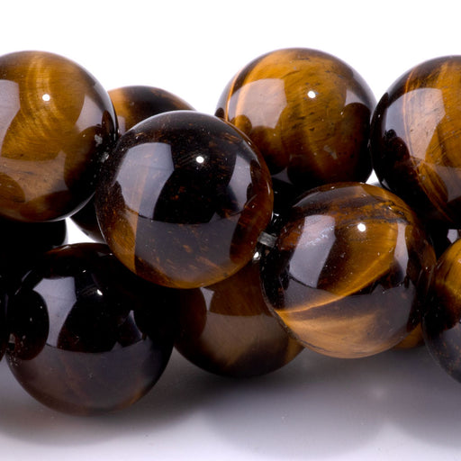 This is a Dakota Stones 18mm Tiger Eye Gemstone strand with round beads in 15-16 inch strand.