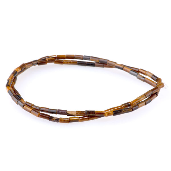 This is a Dakota Stones 2x4mm Tiger Eye Tube Gemstone strand of round beads in 15-16 inch strand.